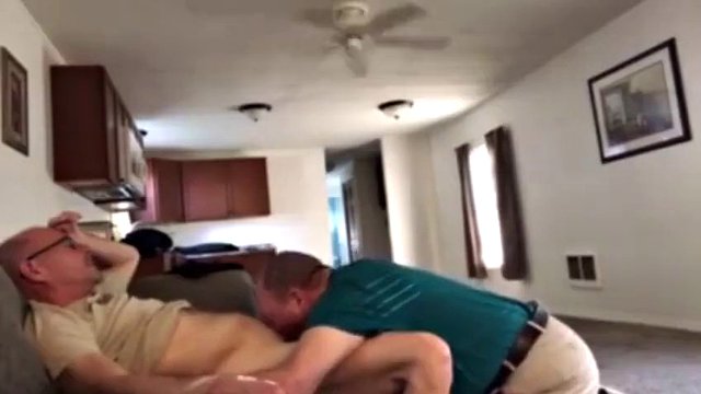 Clothed grandpa on his knees sucking daddy's cock