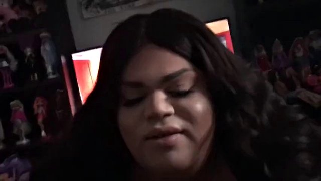 Fat black trans woman sucks a black cock and makes her cum
