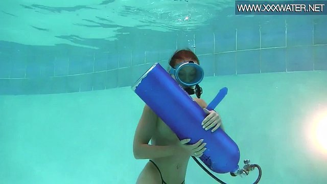 Hungarian beauty fucks a dildo underwater