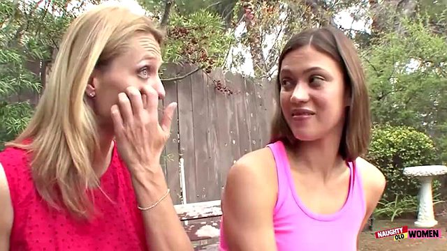 Seduced by a raunchy blonde milf the brunette babe enjoys intense lesbian cunnilingus and fingering
