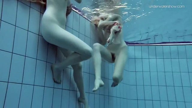 slim euro girls lada and anna swim naked in a pool