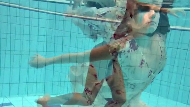 lucy takes the dress off showing her hairy pussy and titties underwater