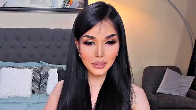Beautiful shemale smokes on camera