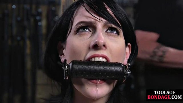 Whipped gagging submissive in dungeon