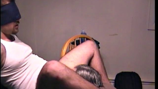 Blindfolded dude receives a blowjob from a mature twink