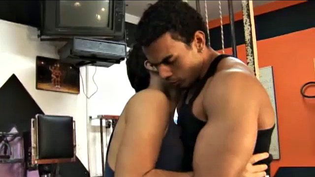 Chao, a muscular Hispanic gym instructor, is finishing up his latest client, who is a rookie. Since Chao has already closed the gym, he decides to give cute Poax an extra lesson in bareback gay sex.