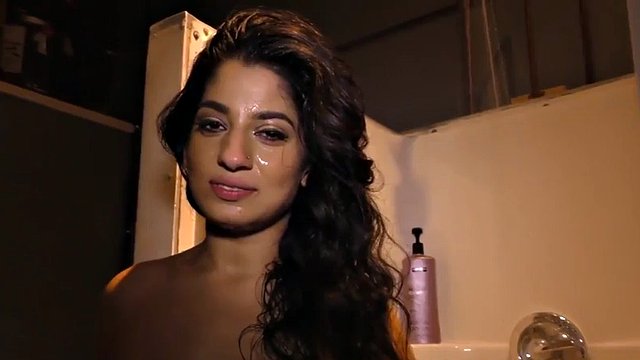 Nadia Ali has fun with a black cock in a glory hole