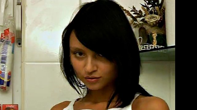 hot brunette plays with her tight pussy in the bathroom
