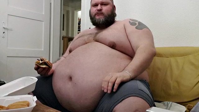 Superchubby SOC - fat guy eating a big burger and onion rings