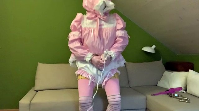 Sissy in diaper with bondage hood