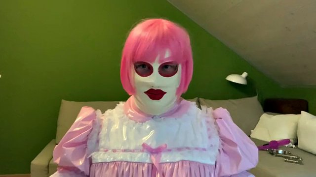 Sissy in diaper with bondage hood